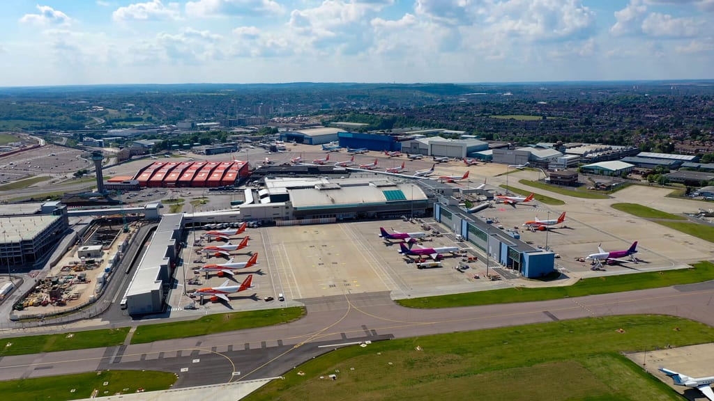 Aerial view of London Luton Airport passenger terminal, apron and aircraft